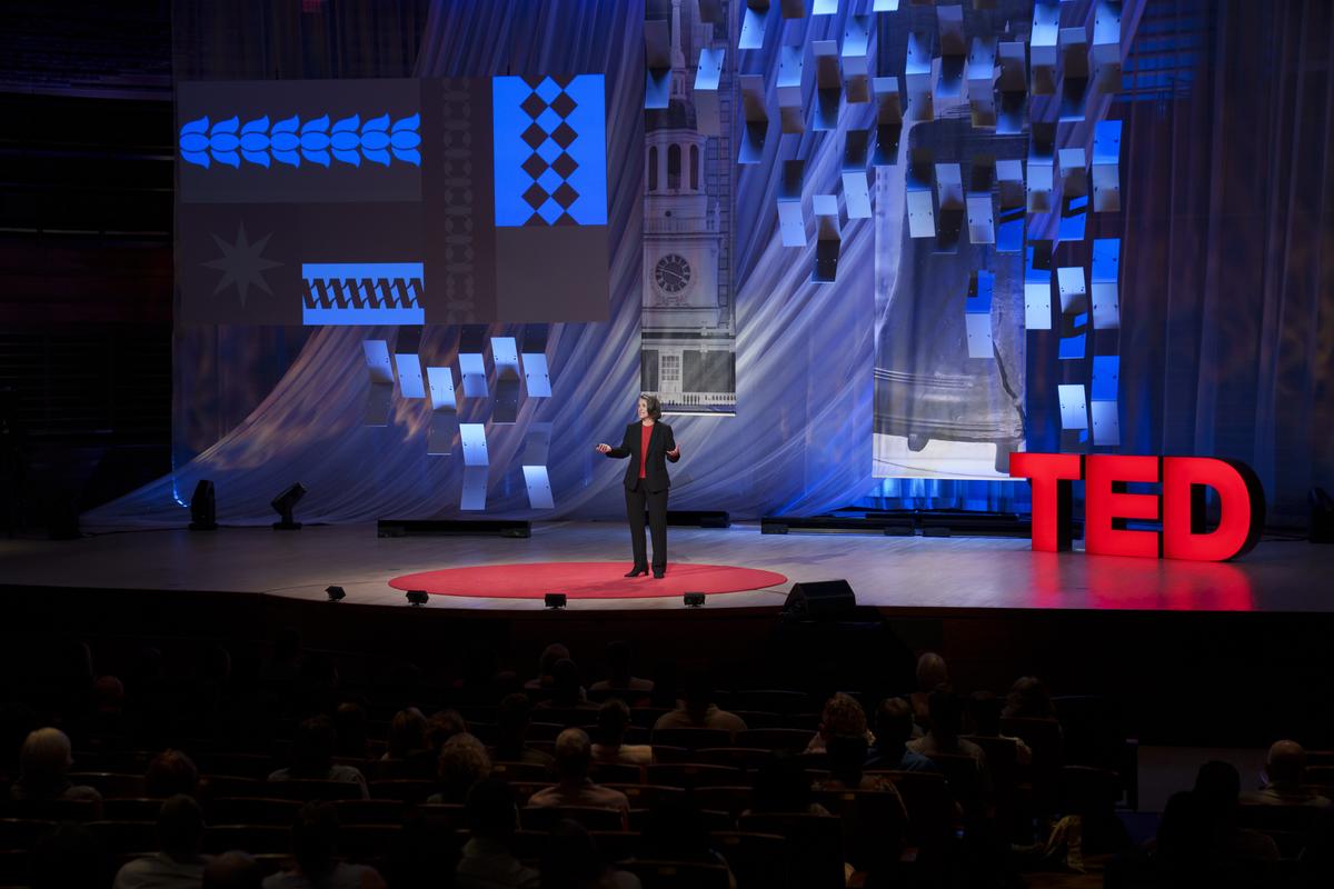 Tami Pyfer speaking on the TED stage at TED Democracy in Philadelphia